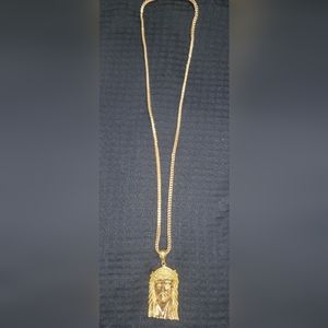 10kt gold necklace  10kt gold religious pendant with clear and yellow diamonds